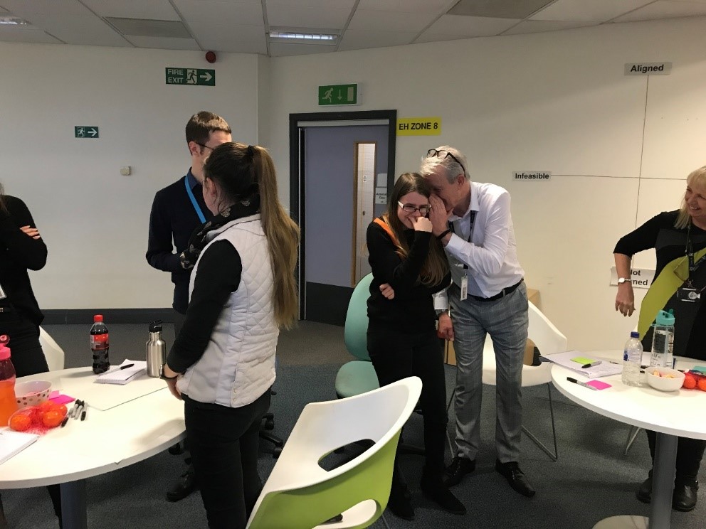 Workshop participants playing Chinese whispers